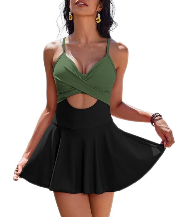 A two-tone swimsuit dress featuring a green twisted halter top and a black high-waisted skirt with a small front cutout below the bust, creating a flattering silhouette.
