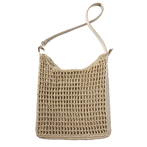 A beige crocheted shoulder bag with a long strap and an open, airy weave design.