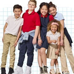 Five children in school uniforms, including polo shirts, khaki pants, a jumper, a skirt, and sneakers.