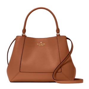 A brown leather Kate Spade New York handbag featuring a top handle and a detachable shoulder strap, with a gold logo embossed on the front.