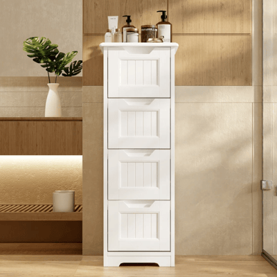 A white, tall storage cabinet with multiple drawers stands against a wooden wall in a room. The top is adorned with various toiletry items, and there's a decorative vase with green leaves nearby.