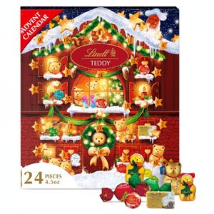A Lindt Teddy Advent Calendar with 24 numbered windows, behind which are assorted chocolates, illustrated with festive teddy bear imagery.