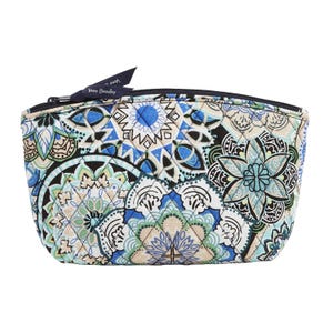 Vera Bradley cosmetic bag with a quilted design featuring blue, green, and beige floral and geometric patterns, complemented by a black zipper and a small Vera Bradley tag.
