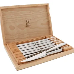 Zwilling Steak Knife Set, 8 pieces, features sharp, stainless steel blades with smooth handles. Housed in a natural wood storage case, ideal for safe keeping and presentation.