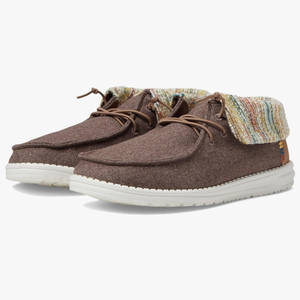 A pair of brown chukka-style shoes with white soles and multicolored knit detailing.