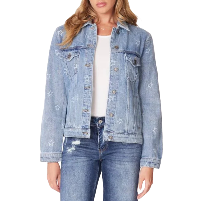 A denim jacket with star patterns, worn by a person over a white top and paired with blue jeans.