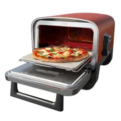 A red countertop pizza oven with an open door displays a freshly baked pizza inside.