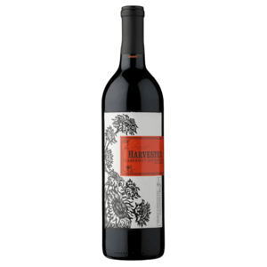 Harvester Cabernet Sauvignon wine bottle with a black and white floral design and an orange label.