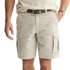 Tan cargo shorts with a belt, featuring side pockets and a button closure.