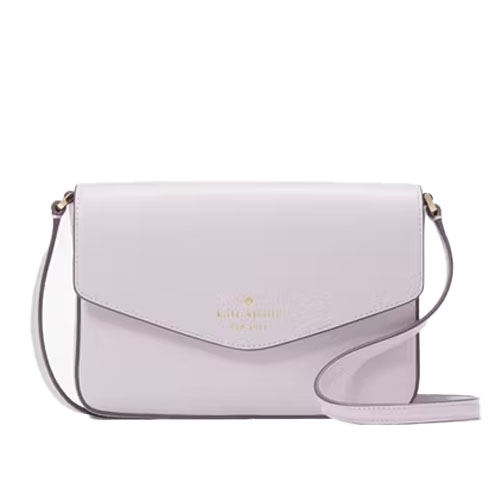A pastel purple crossbody bag with a flap closure and adjustable strap, featuring gold-tone hardware and a subtle logo imprint.