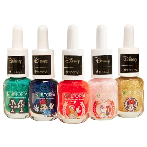 Nailtopia Disney Macy's Minnie 5pc Polish set includes five nail lacquers in a variety of colors: teal, blue, red, pink, and gold. Each bottle features Disney-themed designs and is bio-sourced, offering a playful and vibrant manicure option.