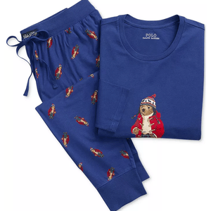 Blue Polo Ralph Lauren pajama set featuring a shirt and pants with an embroidered bear design. The shirt has a large bear on the front, while the pants have a repeating pattern of smaller bears.