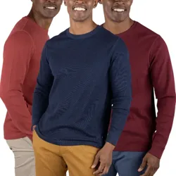 Three men wearing crew neck sweaters in red, navy, and maroon, paired with khaki and blue pants.