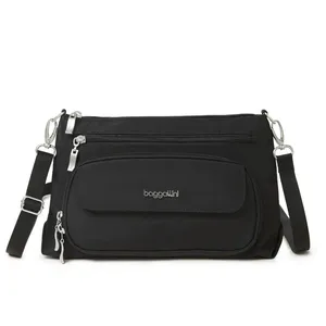 A black crossbody bag with multiple zippered compartments, silver hardware, and an adjustable strap. Brand logo visible on the front pocket.