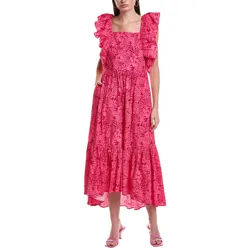A woman wearing a pink, maxi-length dress with floral patterns, ruffled sleeves, and square neckline. She pairs the dress with pink heeled sandals.