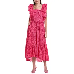 A woman wearing a pink, maxi-length dress with floral patterns, ruffled sleeves, and square neckline. She pairs the dress with pink heeled sandals.