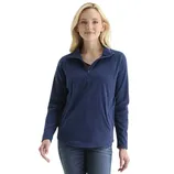 A woman is wearing a navy blue, long-sleeve pullover with a quarter-zip design and jeans.