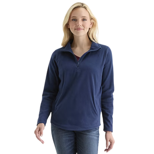 A woman is wearing a navy blue, long-sleeve pullover with a quarter-zip design and jeans.
