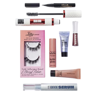 A selection of beauty products including Stila eyeliner, UOMA mascara, Lilly Lashes, NYX butter gloss, Smashbox primer, Buxom lip gloss, bareMinerals concealer, and Lancôme serum.