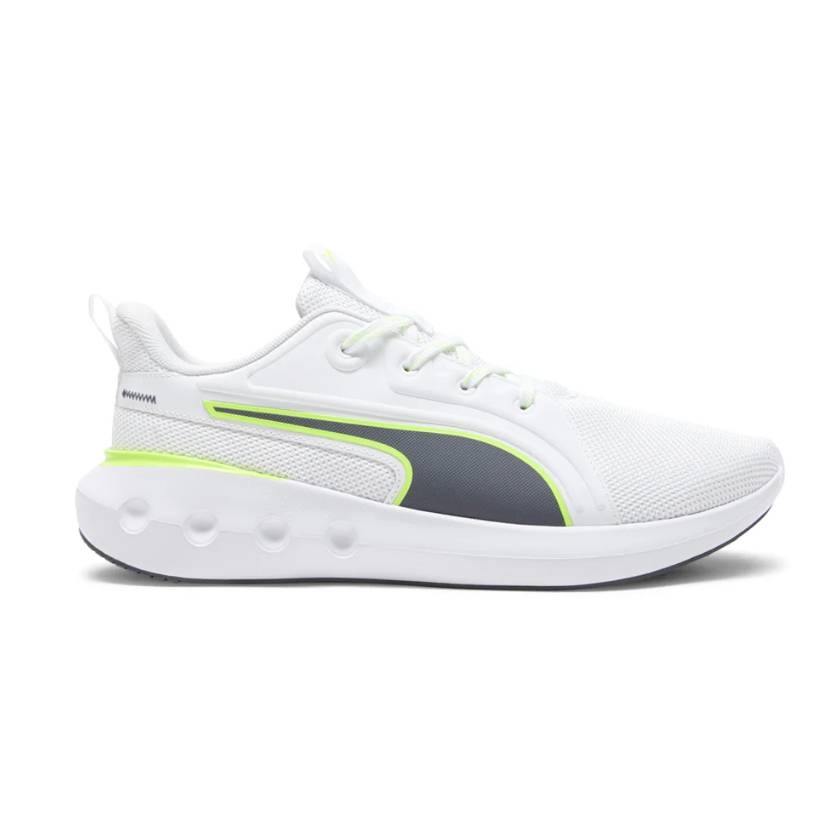 White Puma Carson sneakers with a breathable mesh upper, featuring a neon green accent and a grey stripe. The shoes have a cushioned sole with circular design details for comfort and style.