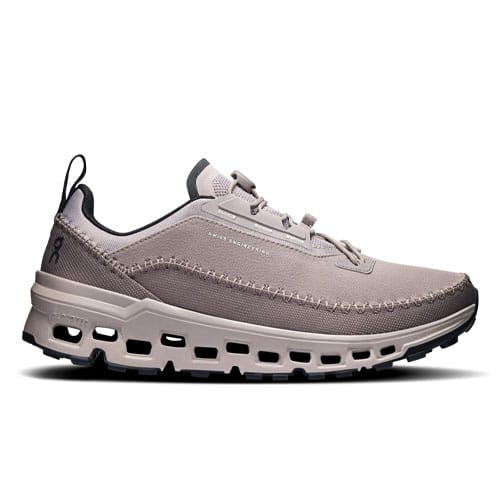 A taupe sneaker featuring a breathable mesh upper, cloud-like cushioning, and a distinctive sole with cut-out details for enhanced comfort and style.