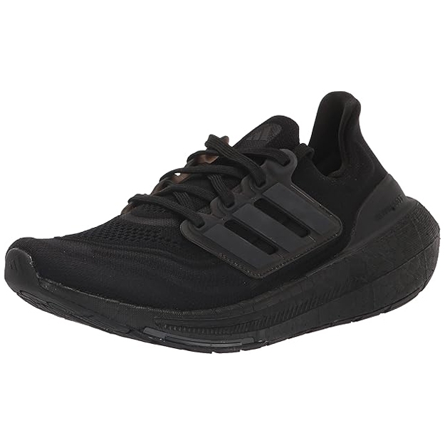 Women's Adidas Ultraboost shoes in black feature a knit upper, cushioned midsole, and signature three-stripe design on the side, offering comfort and support for athletic activities.