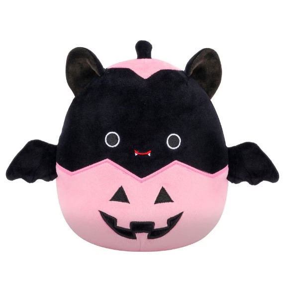 This is a plush toy designed to resemble a bat with a pink and black color scheme and a jack-o'-lantern smile.