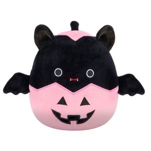 This is a plush toy designed to resemble a bat with a pink and black color scheme and a jack-o'-lantern smile.