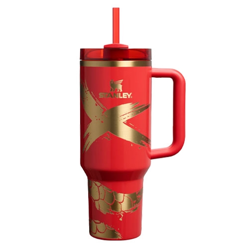 A red 40oz Stanley Lunar New Year Tumbler featuring a bold gold \“X\“ design, gold accents, and a handle, complete with a matching red straw.