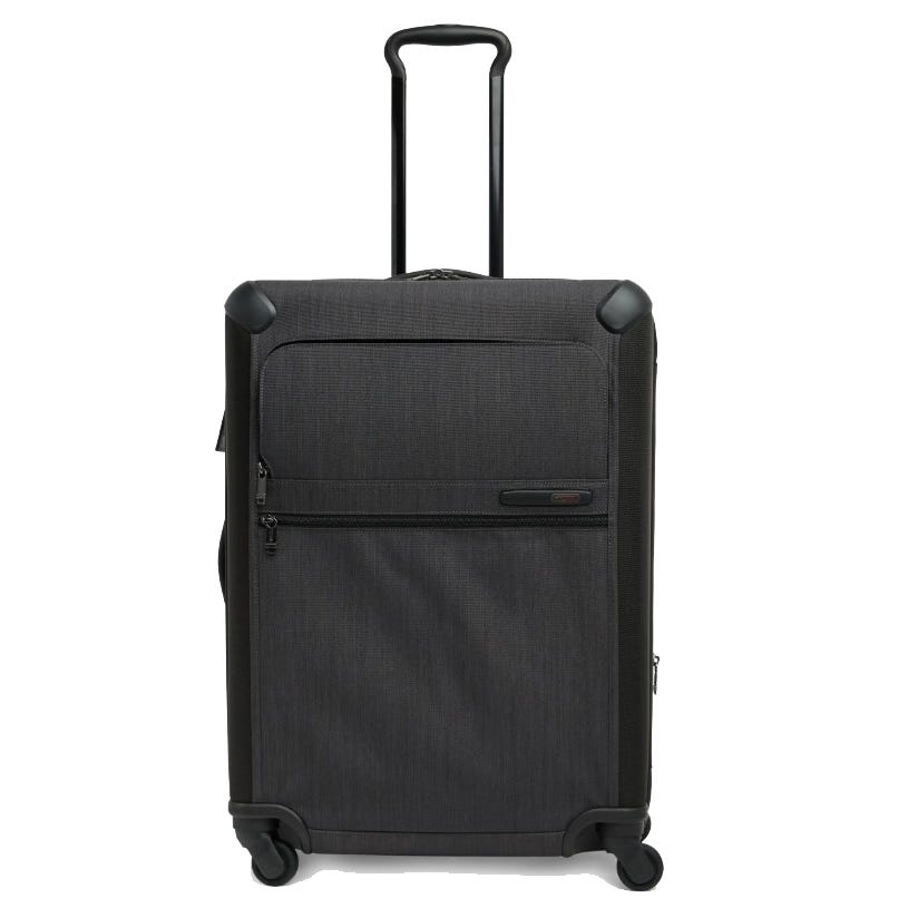 A black hard-sided suitcase with four spinner wheels, a telescopic handle, and a front zipper pocket.