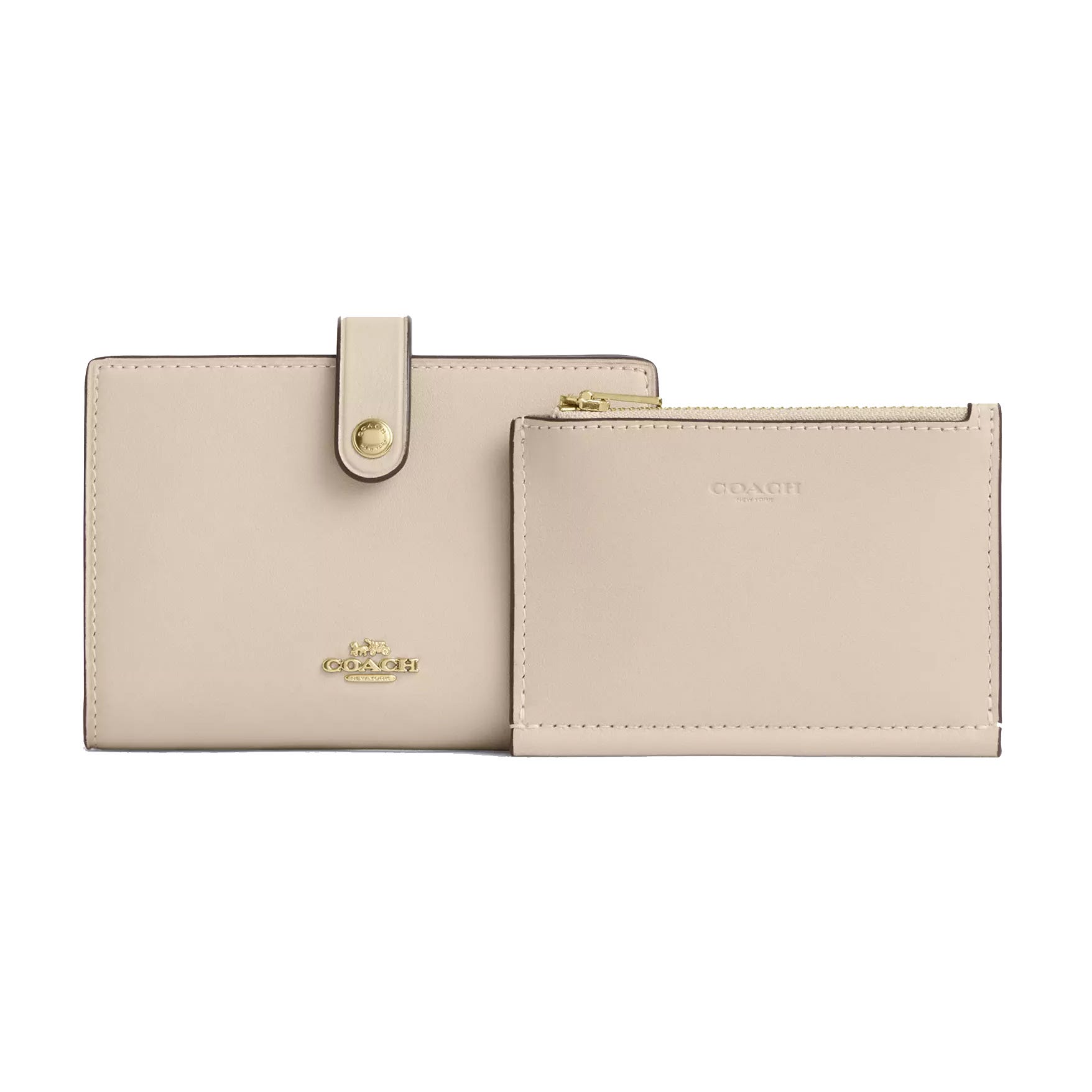 A beige Coach wallet and pouch set featuring gold-tone hardware and a zippered compartment.