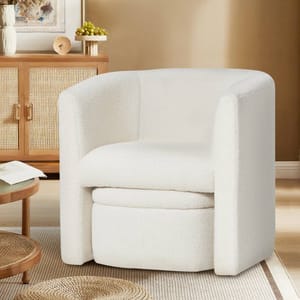 White accent chair with rounded edges and a matching storable ottoman, set in a cozy room with warm tones and natural wood textures.