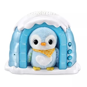 A plush penguin toy in a blue igloo with buttons on the side for different functions, such as music and sounds.