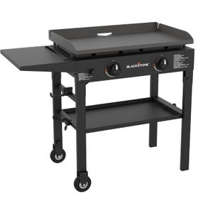 Blackstone 28\“ Griddle is a two-burner outdoor propane griddle with a flat top cooking surface, side shelf, and wheeled cart for mobility.