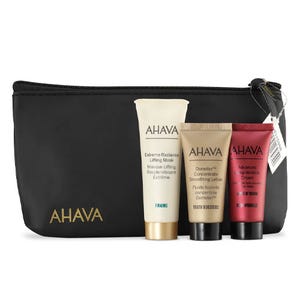 A black AHAVA pouch contains three skincare products: Extreme Radiance Lifting Mask, Osmoter Concentrate Smoothing Lotion, and Advanced Deep Wrinkle Cream.