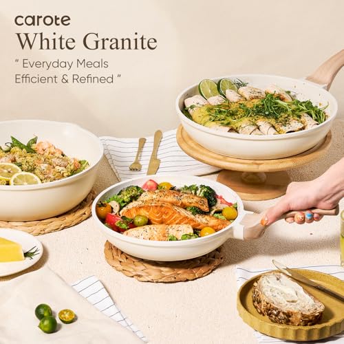 A selection of Carote White Granite cookware is displayed, featuring dishes with various foods, including salmon and vegetables. Text states: \“Everyday Meals Efficient & Refined.\“