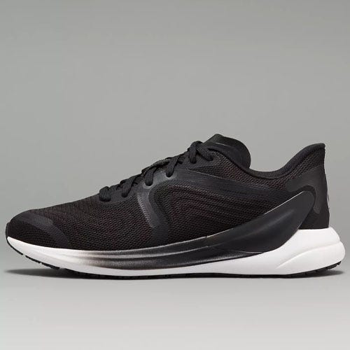a pair of black and white lululemon running shoes