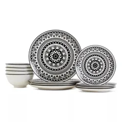 Black and white dinnerware set featuring plates and bowls with intricate geometric patterns.
