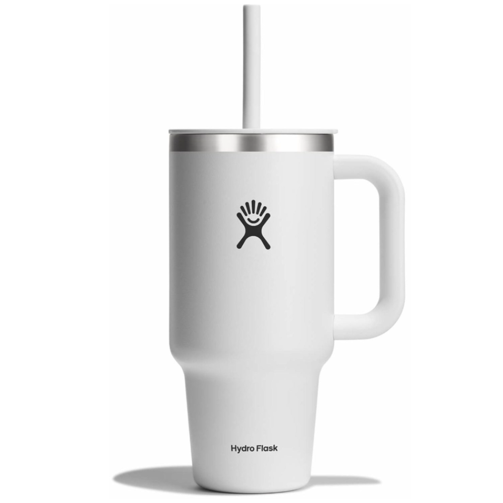 A white Hydro Flask tumbler with a handle and straw, featuring the brand's logo on the front.