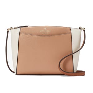 A two-tone crossbody bag with tan and white pebbled leather, featuring a zip closure and a thin adjustable strap.