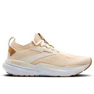 Beige Brooks StealthFit 21 running shoes with a streamlined design, featuring a breathable knit upper, cushioned midsole, and durable outsole for comfort and support.