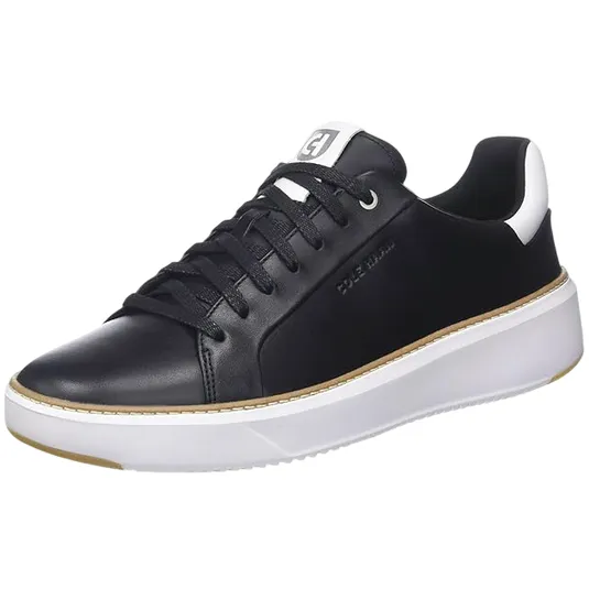 A black leather sneaker with black laces, a white cushioned sole, and subtle branding on the side.