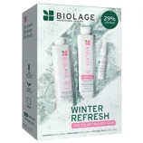 Biolage Winter Refresh set for color-treated hair includes a 13.5 fl oz shampoo, 13.5 fl oz conditioner, and a 1 fl oz repairing spray, offering 29% savings. The packaging highlights 100% recycled plastic and a vegan formula.