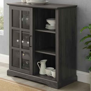 31.5\“ bar cabinet with a sliding glass door, featuring multiple shelves for storage. The cabinet holds dishes, cups, and bottles, with a dark finish and a decorative bottom edge.