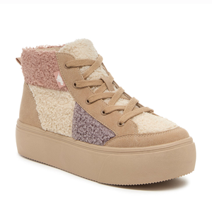 Tan platform Sherpa boots with multicolor patches in cream, mauve, and light purple. Features a lace-up design and thick sole for added height.