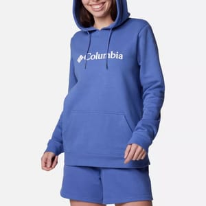A person is wearing a blue hoodie with the Columbia brand logo and matching blue shorts.