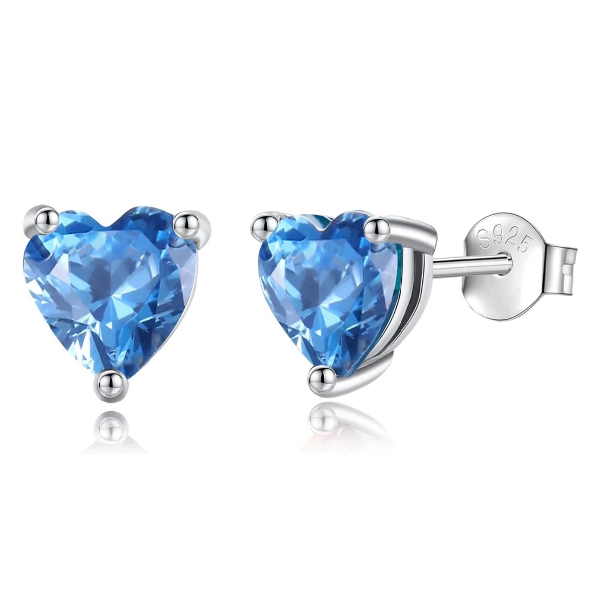 Silver stud earrings with heart-shaped blue gemstones, featuring an \“S925\“ mark indicating sterling silver.