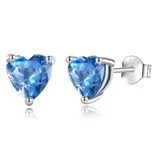 Silver stud earrings with heart-shaped blue gemstones, featuring an \“S925\“ mark indicating sterling silver.