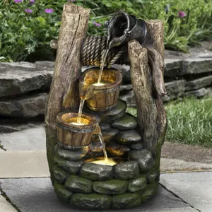 Decorative garden water fountain with a rustic wood and stone design, featuring a bird figurine pouring water into cascading barrels.
