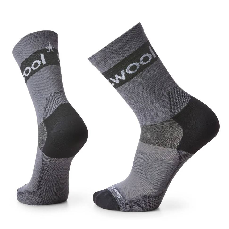 A pair of gray wool socks with reinforced heel and toe areas, designed for comfort and durability.